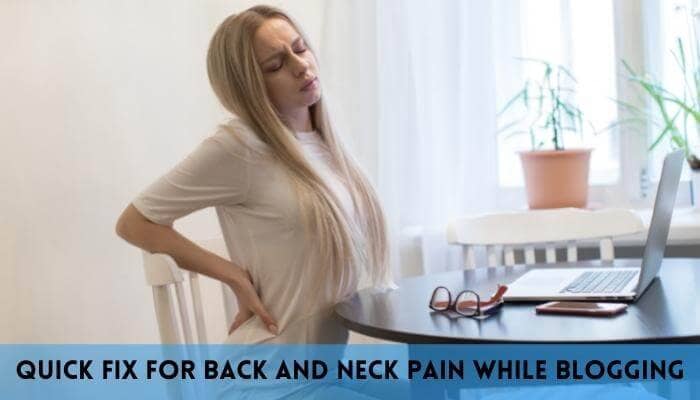 Woman suffering from back pain while working